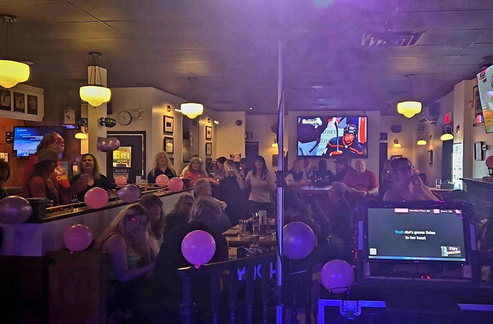 Guests celebrating at Pitcher's Sports Bar