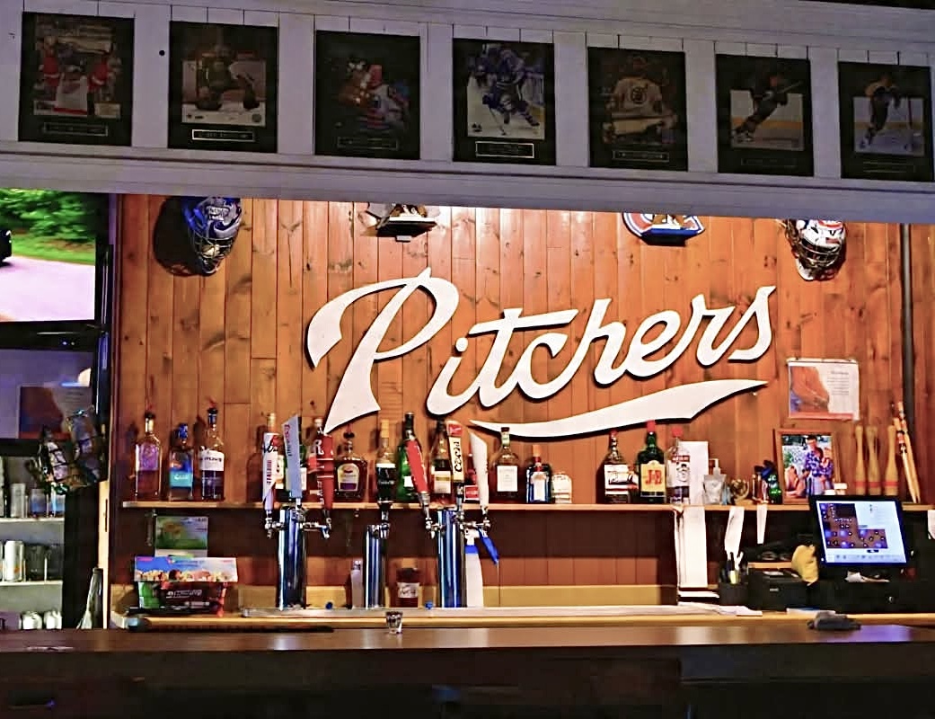 Pitcher's Sports Bar taps and sign